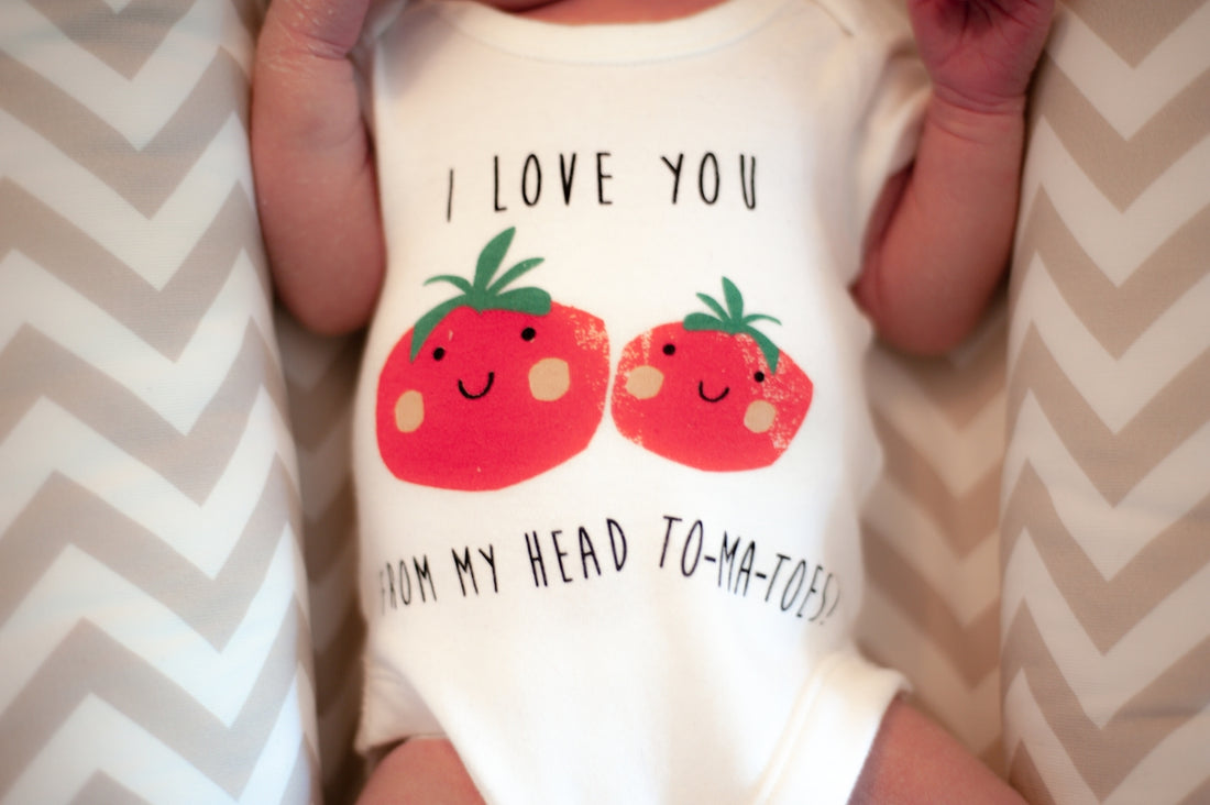 baby in white and red bear printed shirt