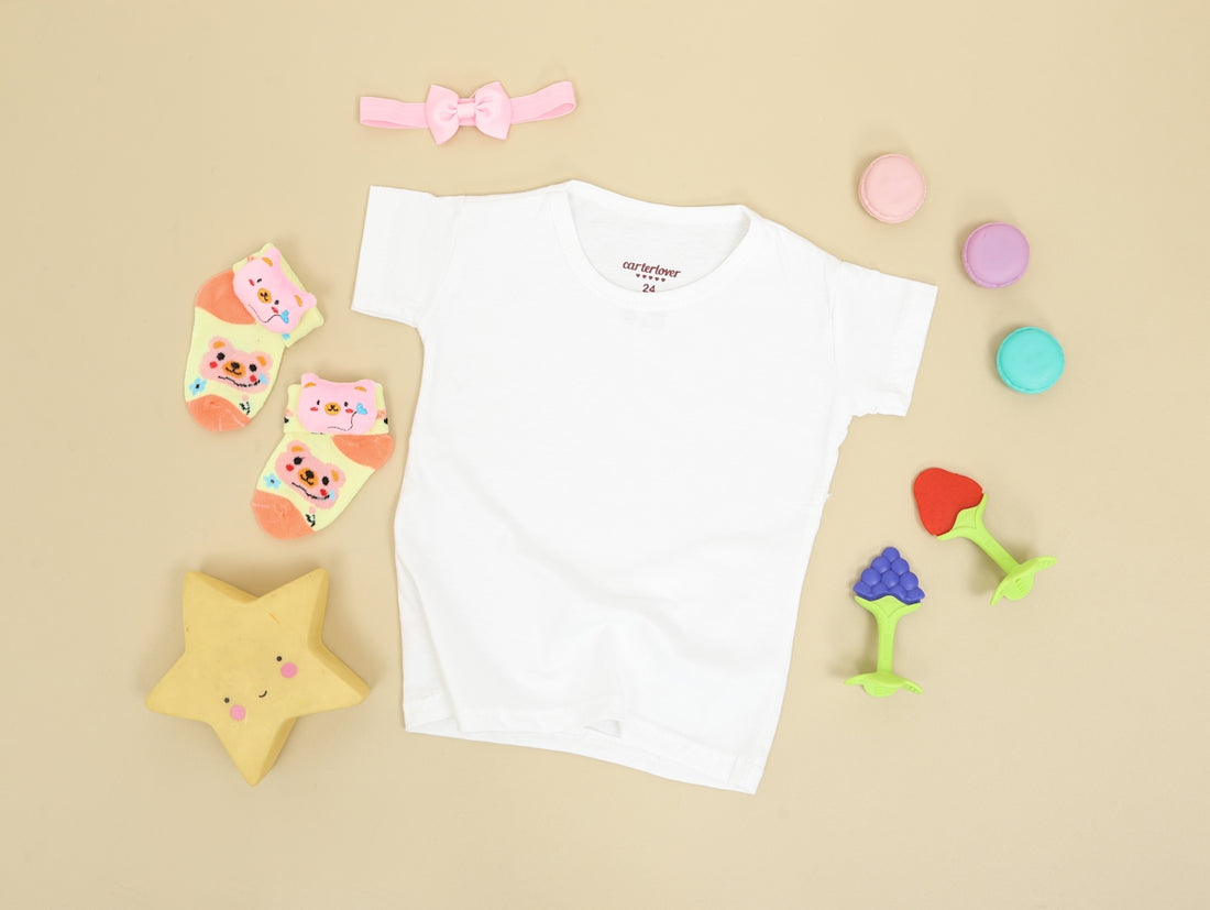 babys white onesie and pink and white bear print onesie