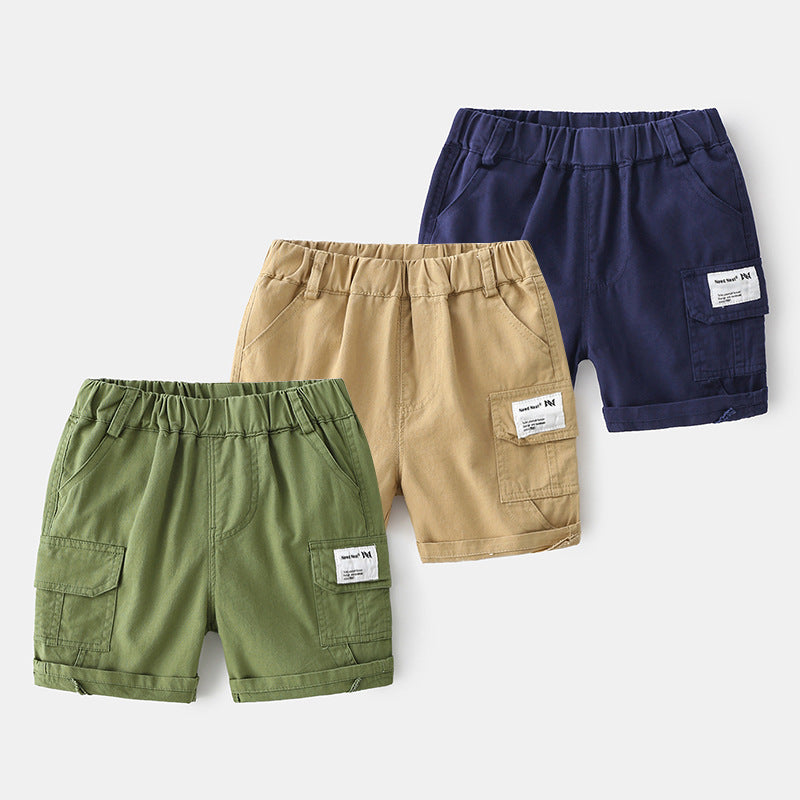 Set of three cotton boys cargo shorts in green, beige, and navy with elastic waistbands