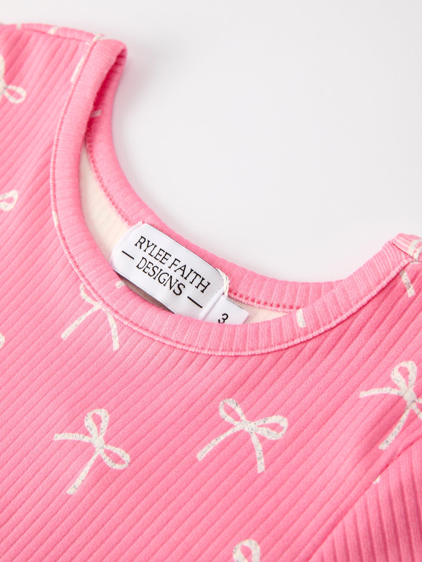 Carmelia Christmas Bow Girls Dress: Festive and Adorable Design