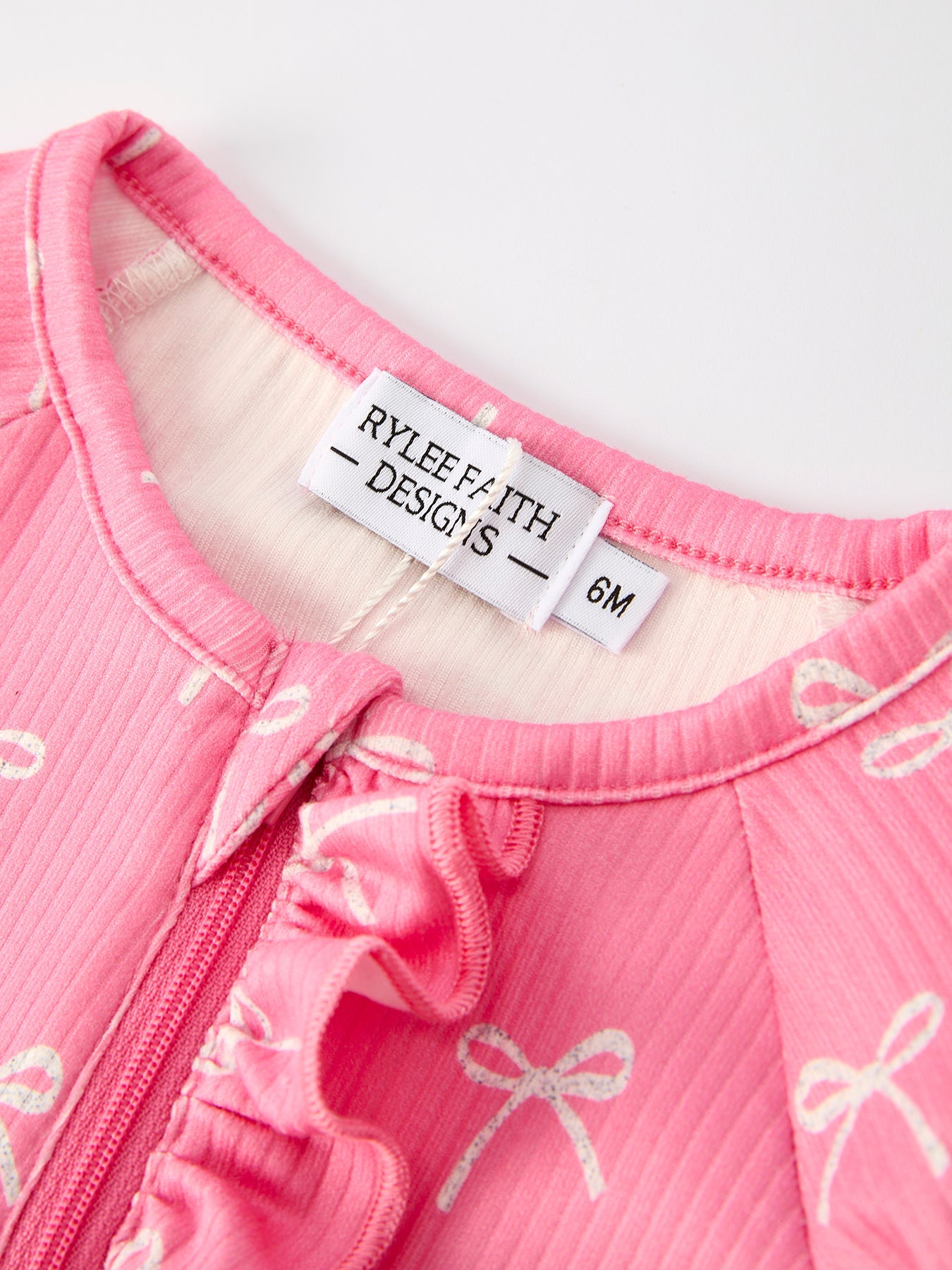 Carmen Bow Pink Romper with Hat: Sweet and Stylish Baby Outfit