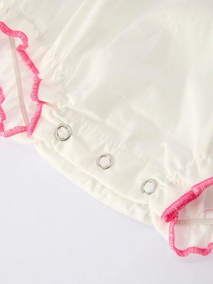 White fabric with pink trim and metal grommets on a white background