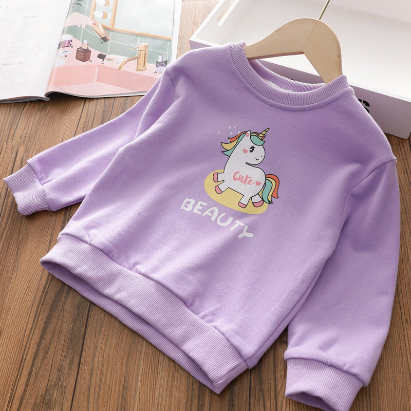 Lilac kids sweatshirt with cute unicorn and text 'cute beauty' on wooden surface