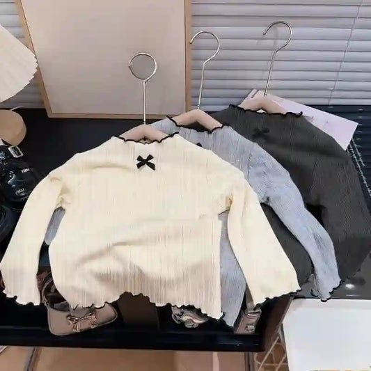 Belen Long Sleeved Ruffled Edge Bow Tops