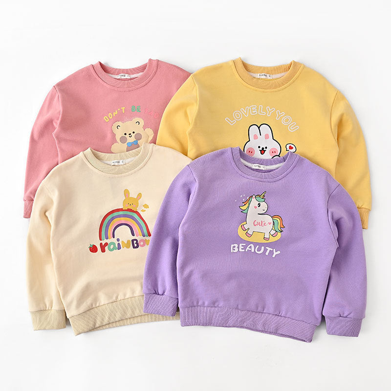 Four colorful kids sweatshirts with cute cartoon designs and positive words on white background