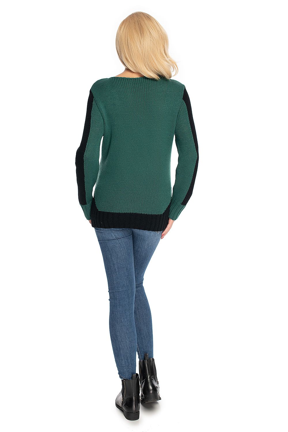 Person wearing a green sweater with black sleeves on a white background